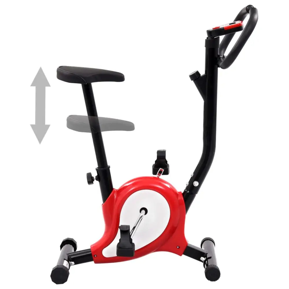 Stationaire hometrainer met een rood en wit frame en verstelbare zitting.