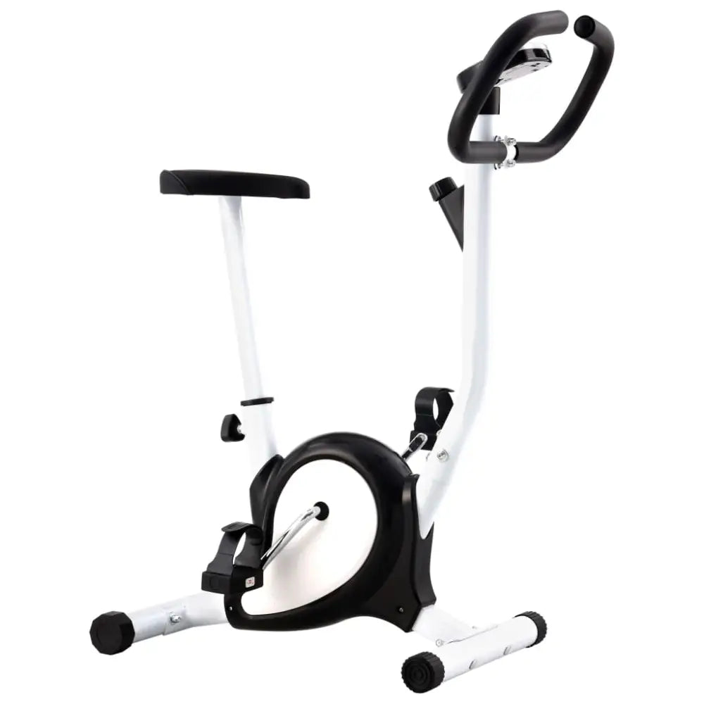 Stationaire hometrainer met een wit frame en zwarte accenten.